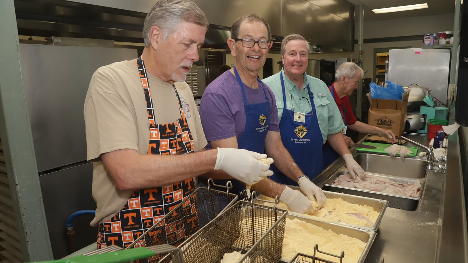 Council 12906 members serving food at a parish fish fry