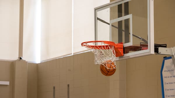 Basketball passing through the hoop at the free throw contest